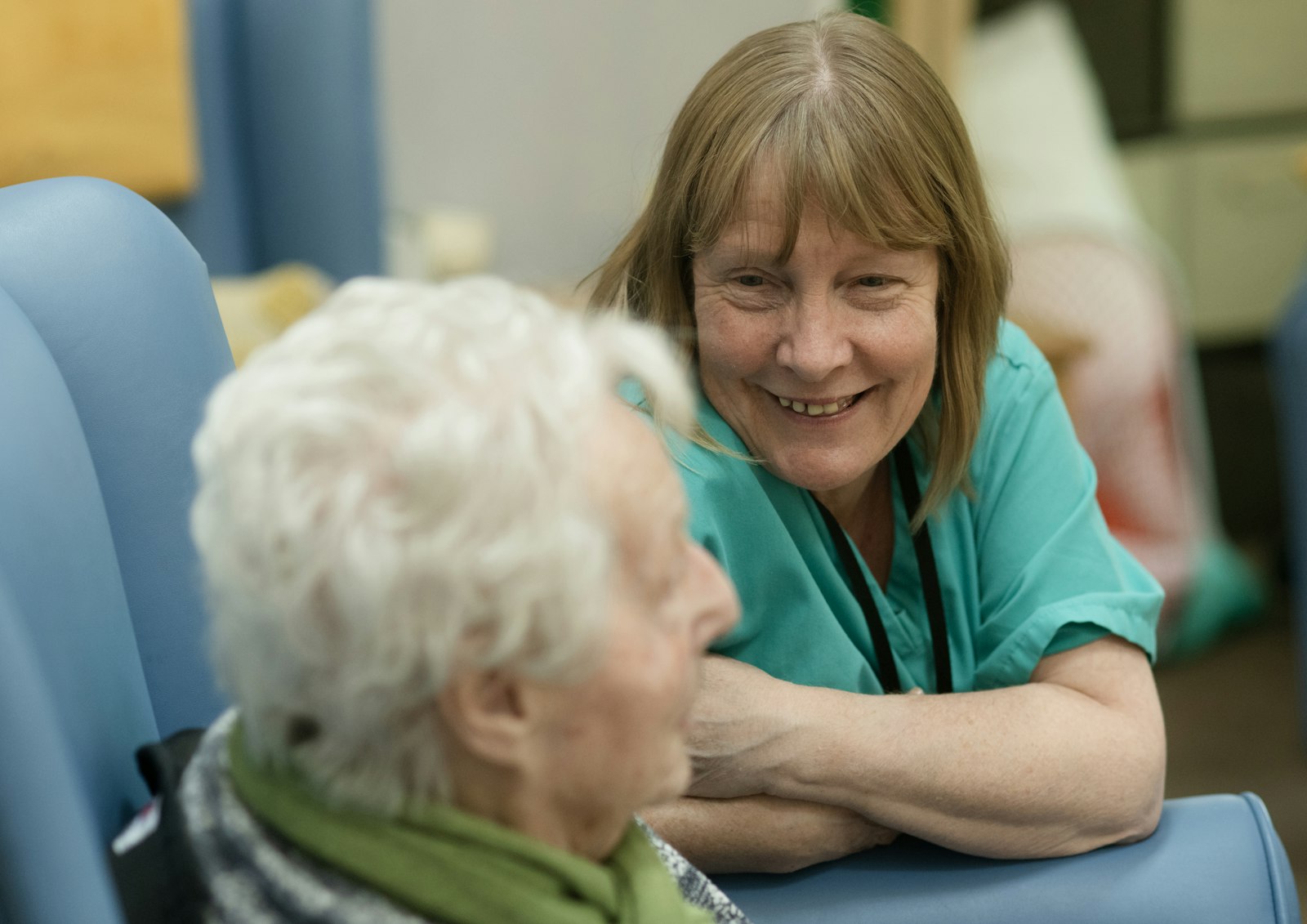 Care worker speaking warmly with an older person